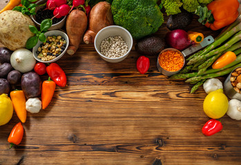 Assortment of fresh vegetables on wooden background