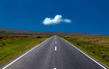 The ribbon-like road that's been recently tarmacked and painted that leads past Broadpool and Arthur's Stone on the Gower peninsula in Swansea, South Wales UK.