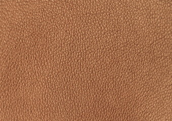 The texture of genuine leather. Impeccable and stylish background. Beautiful stylish background. Natural skin texture close up. Brown background.  The structure of the leather material brown shades.