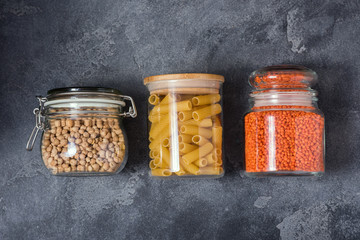 Pasta, chickpeas, lentils in glass jars, eco-friendly lifestyle and shopping, zero waste storage concept