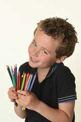 child with colored pencils