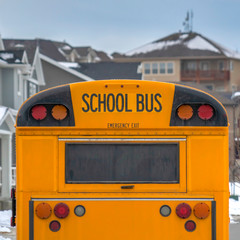 Clear Square Yellow school bus with rectangular window and several signal lights at the rear