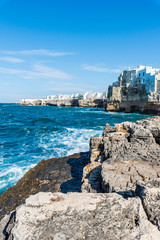 Rough sea on the coast of Puglia. Enchantment of Polignano a Mare. Italy