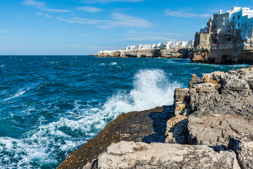 Rough sea on the coast of Puglia. Enchantment of Polignano a Mare. Italy