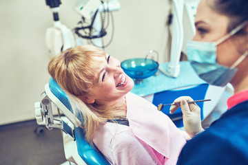 Dentist examining a patient's teeth in the dentist.