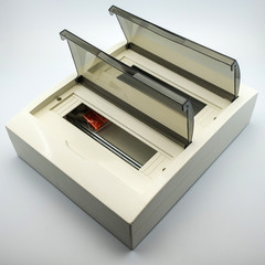 The photo on a white background electrical box for connecting wires for mounting electrics. Perfect for filling the catalog of a modern iniernet store on the site.