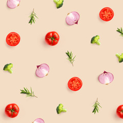 Creative pattern made of tomato, broccoli and onion on beige background. Flat lay. Food concept.