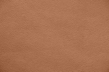 The texture of genuine leather. Impeccable and stylish background. Beautiful stylish background. Natural skin texture close up. Brown background.  The structure of the leather material brown shades.