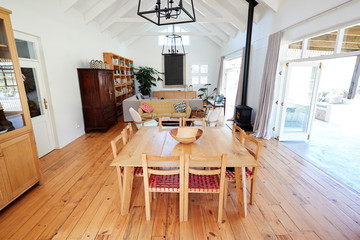 Dining Table With Chairs And Seating Area In Stylish And Contemporary Open Plan Empty Home