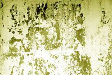 Сraked weathered cement wall texture in yellow tone.