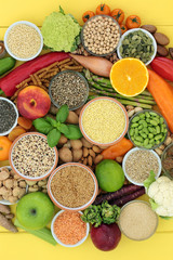 Health food for vegans with fruit, vegetables, seeds, nuts, grains, legumes, cereals, sos mix, pasta and herbs. High in antioxidants, protein, dietary fibre, vitamins and omega 3. Top view.