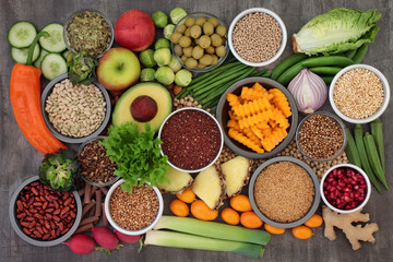 Alkaline health food concept for ph balance with vegetables, fruit, herbs, spice, whole wheat pasta & grains, legumes, green tea, seeds &  nuts. High in omega 3, antioxidants, fibre & vitamins.