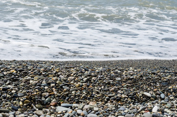 the coast with small pebbles