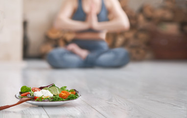 Young woman do yoga. Healthy food after a workout. 