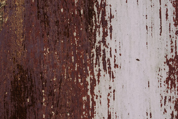Abstract colorful wall texture and background. Close-up iron surface with old white and brown paint