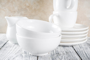 Stack clean empty kitchen utensils