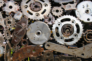 An industrial abstract textured background of old scrap metal car parts welded together
