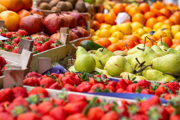 Fresh colorful fruit in wooden baskets ready for sale on the marketplace in Belgrade.