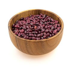 Red beans in a wooden dishes isolated on white background