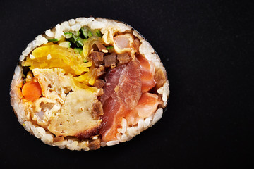 Japanese sushi roll on black background 