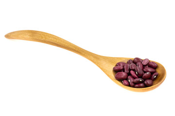 Wooden spoon with red beans isolated on white background