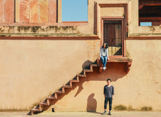 happy young couple exploring Fatehpur Sikri, India