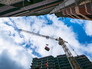 Industrial Crane Works in Construction Site, Developing New Modern Residential Building