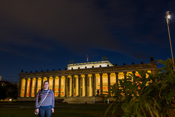 Latin tourist lady poses in Berlin city at twilight hours