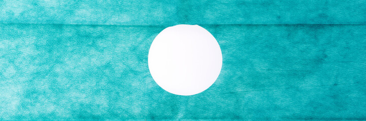 Sterile green gauze with hole for surgeries. Green gauze background