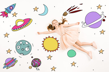 top view of cheerful kid in pink dress flying in space on white