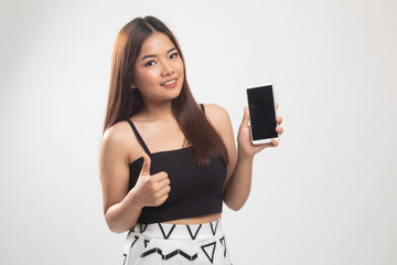 Fototapeta premium Young Asian woman show thumb up with mobile phone.