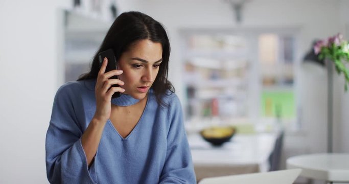 4K Businesswoman making a phone call, getting put on hold & getting fed up. Slow motion.