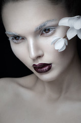 Frontal view of beauty portrait white makeup, burgundy lips, artistic arrangement, close up light...