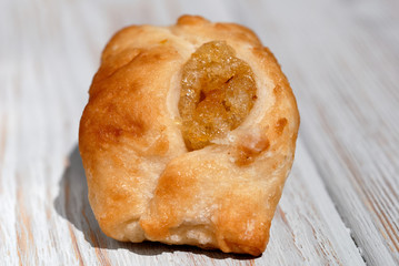 Freshly Baked Bun with Sweet Filling. Shallow depth of field