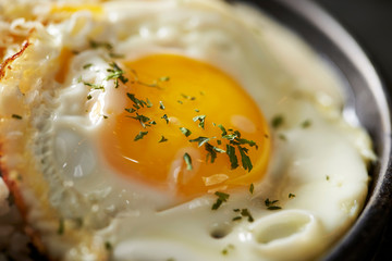 fried eggs with bacon and cheese