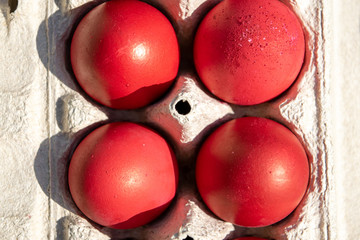Red boiled eggs Easter spring top view