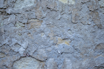Texture of gray stone with potholes and background
