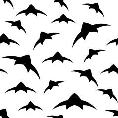 A flock of birds in the sky. Seamless pattern. Black and white vector background EPS10