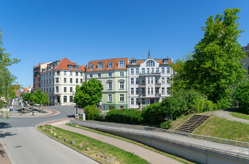 Fototapeta na wymiar street and houses in the city of rostock - sunny day