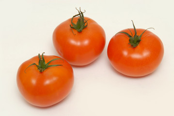 Fresh tomatoes isolated on the gray background