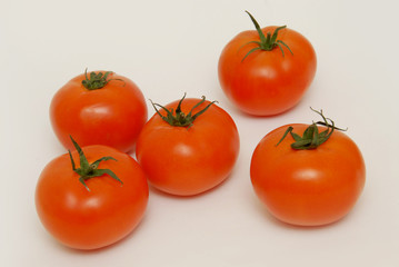 Fresh tomatoes isolated on the gray background