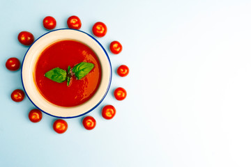 Gazpacho cold summer vegetarian tomato soup with basil in a bowl