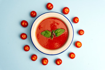 Gazpacho cold summer vegetarian tomato soup with basil in a bowl