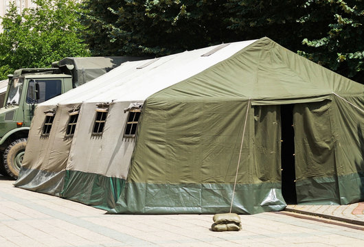 Military tent and truck outdoors