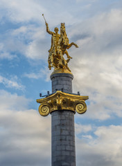 Fototapeta premium Gilded Saint George statue on Freedom Monument in Tbilisi