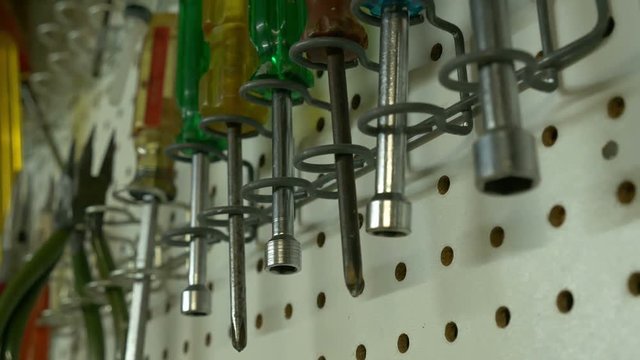 Close up of tools hanging in a workshop