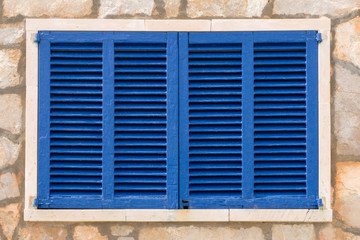 window locked with blue shutters