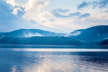 Panoramic view of scenic idyllic winter landscape with lake