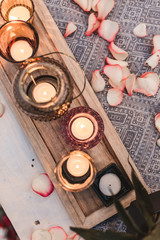 Fototapeta na wymiar decorative candle lights on served romantic dinner table