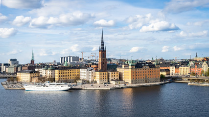 Fototapeta na wymiar Panoramic view of the old town in Stockholm. Riddarholmen - historical part of the Old Town in Stockholm. Cityscape of Gamla Stan Stockholm city.